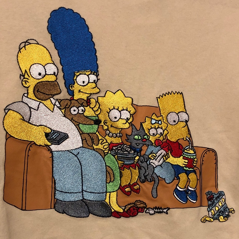 Beige T-Shirt with embroidered Simpson Family Print on front silk screen in back